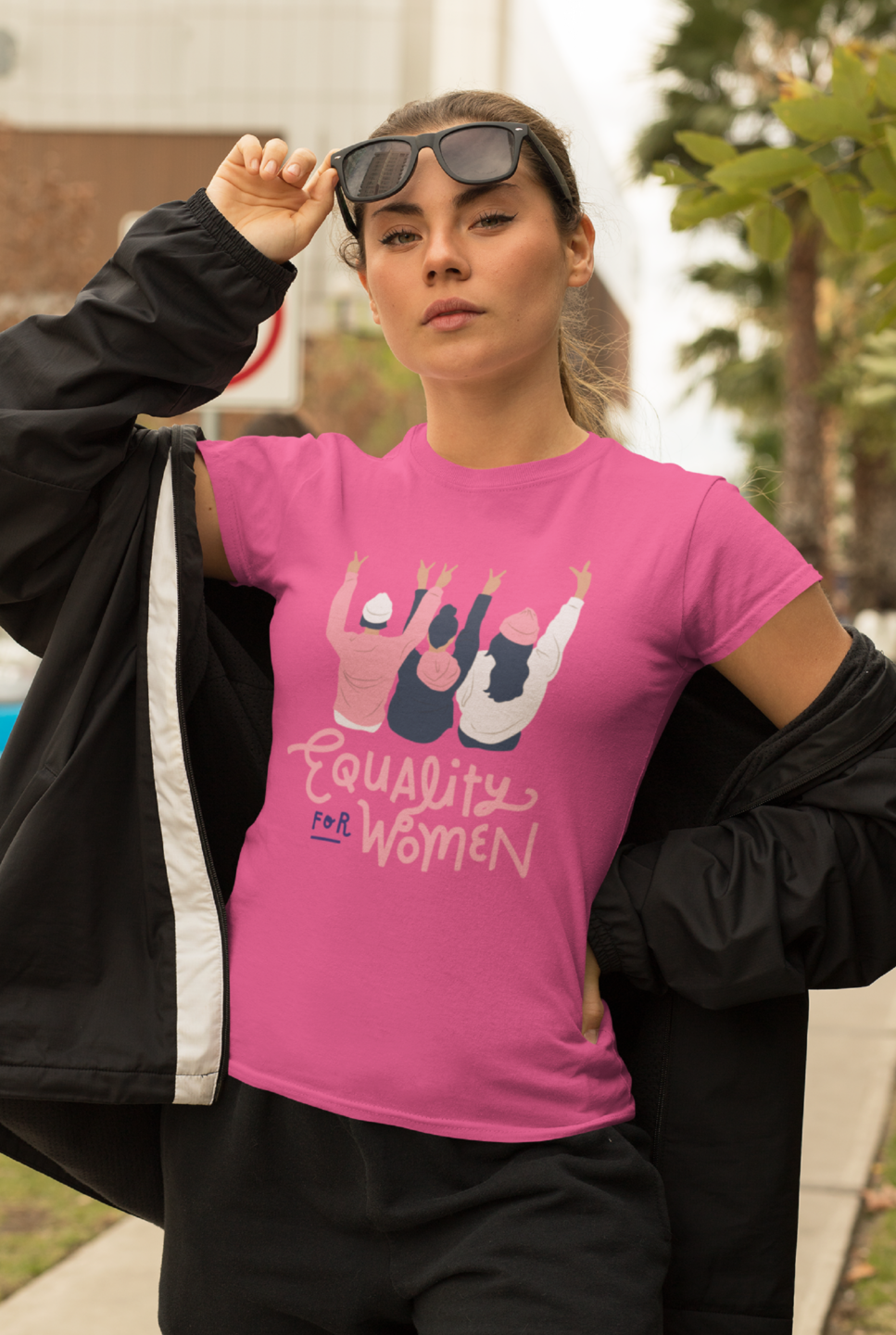 A woman wearing a women's equality t-shirt